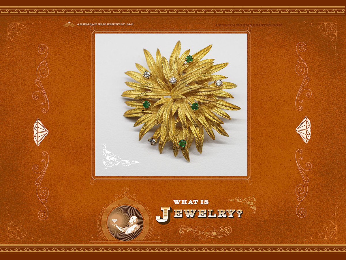 Cover art for the article "What is Jewelry" featuring a piece of jewelry that looks rather like a sea enema.