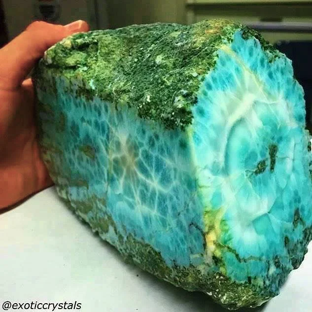 Larimar, a captivating gemstone, is found only in the Dominican Republic. Its unique blue-green hues echo the coral seas of the islands